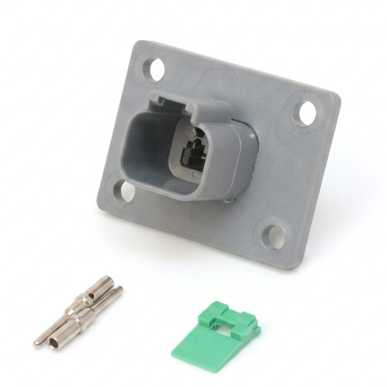 A gray plastic electrical connector block with a square mounting plate, shown on a white background with two small metal terminal pieces and a small green plastic cap.