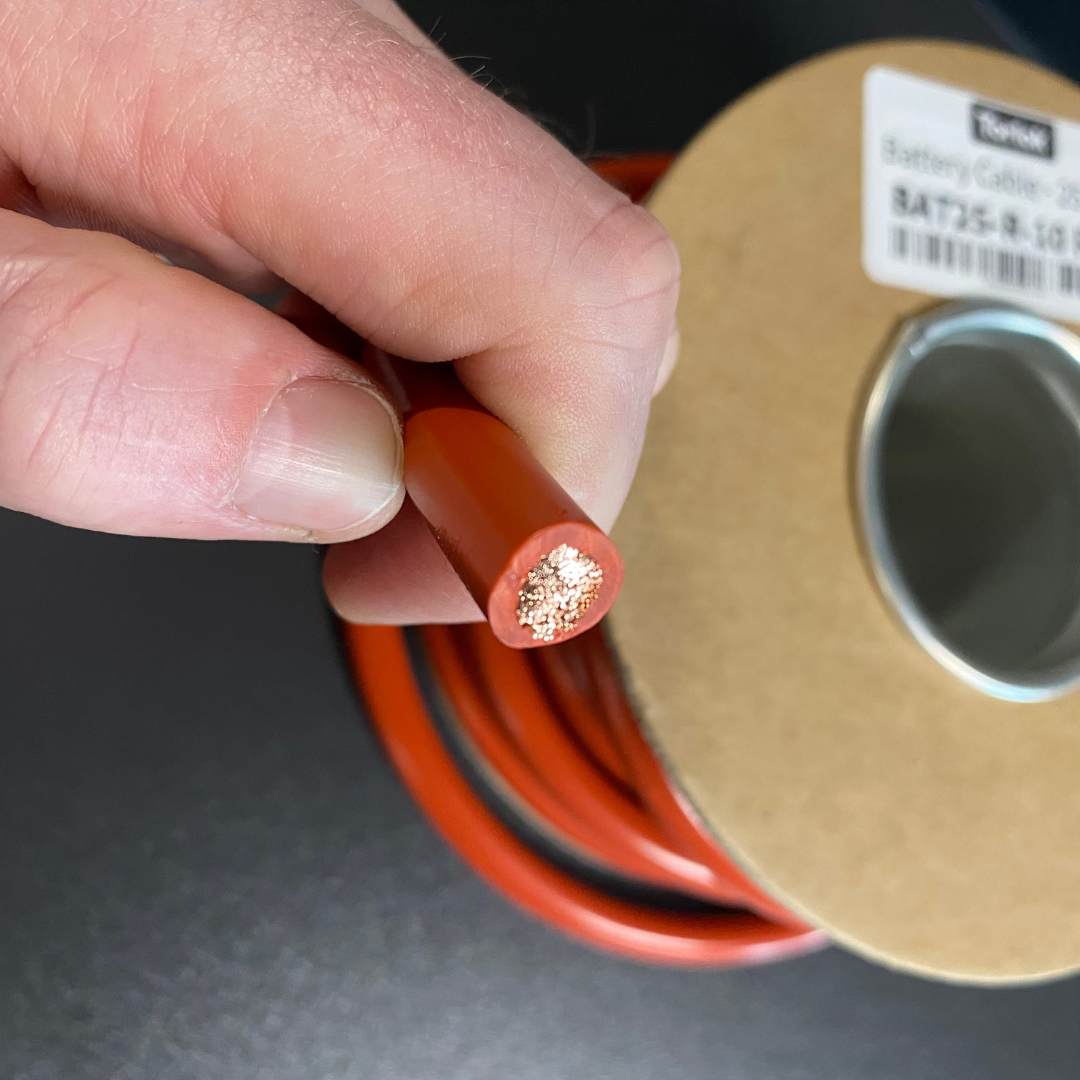 torlok battery cable reel hand holding to show size