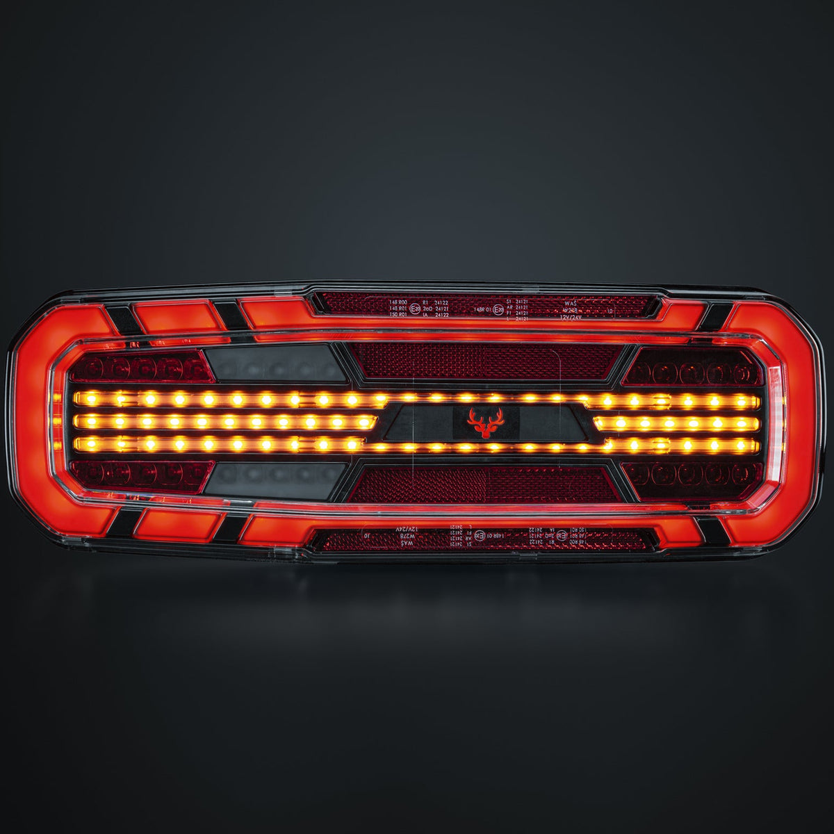A rectangular automotive taillight with a red and black housing, featuring illuminated amber LED light bars across the center, shown on a dark gradient background.