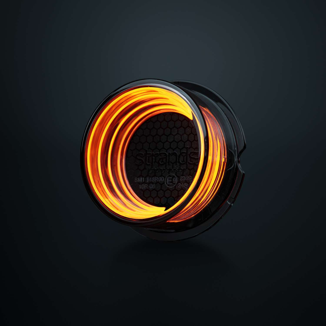 Circular light with orange glow on a black background