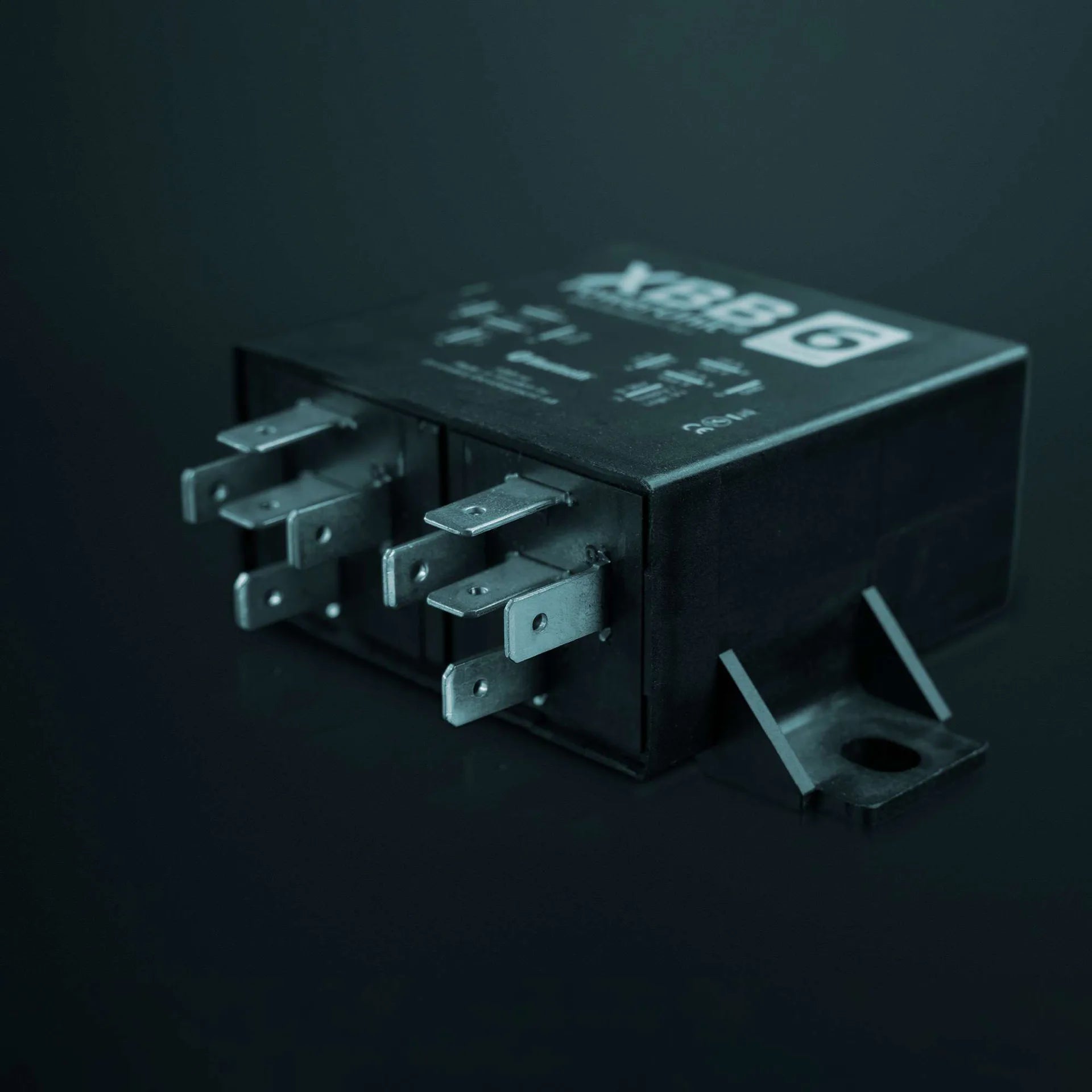 Relay module with multiple contacts on a dark background