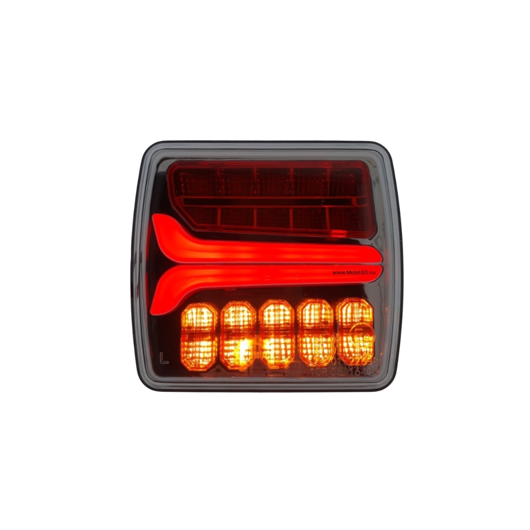 Car tail light with red and orange lenses on a white background